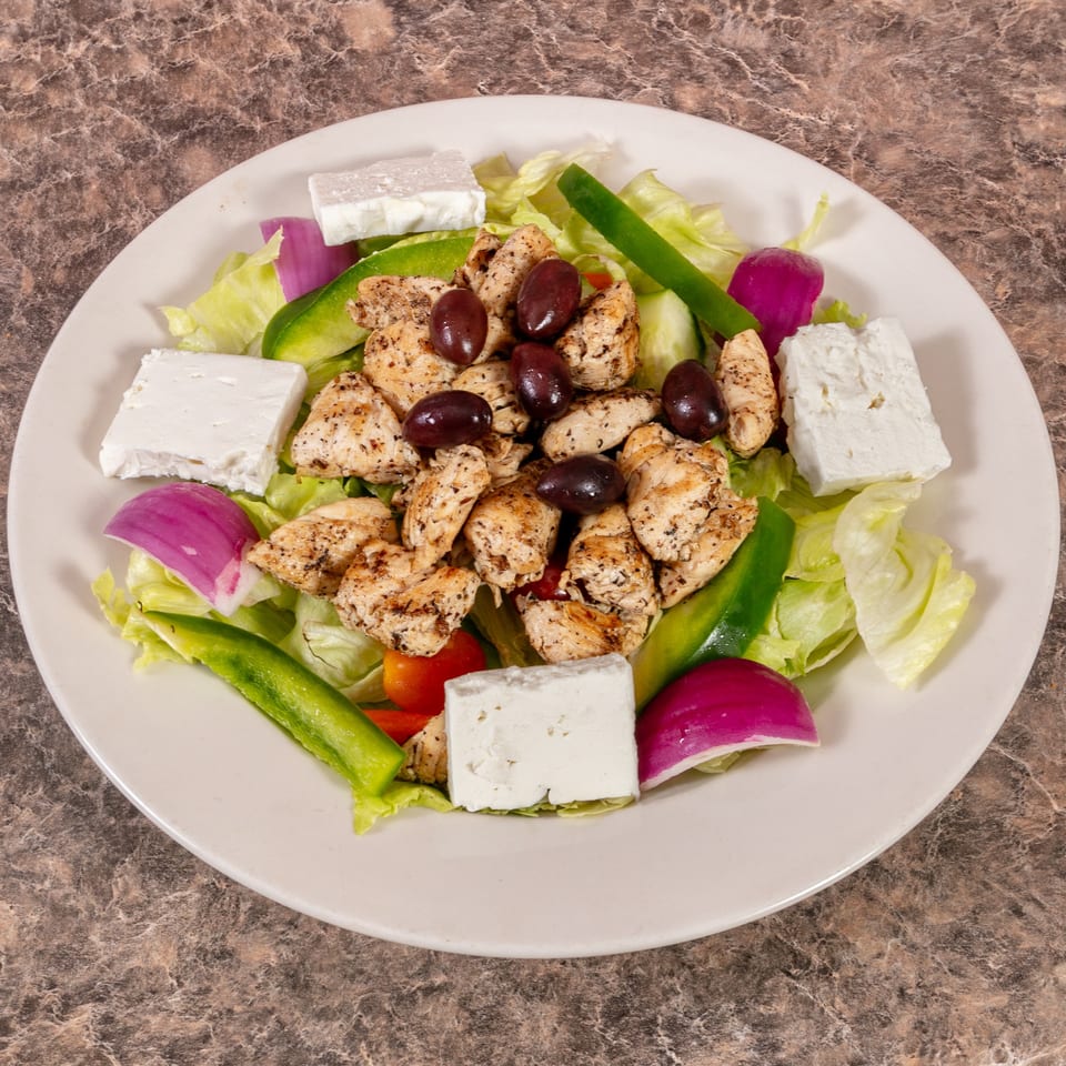 Mr. G's Pizzeria's chicken salad with lettuce, feta, olives, red onion, and green pepper.