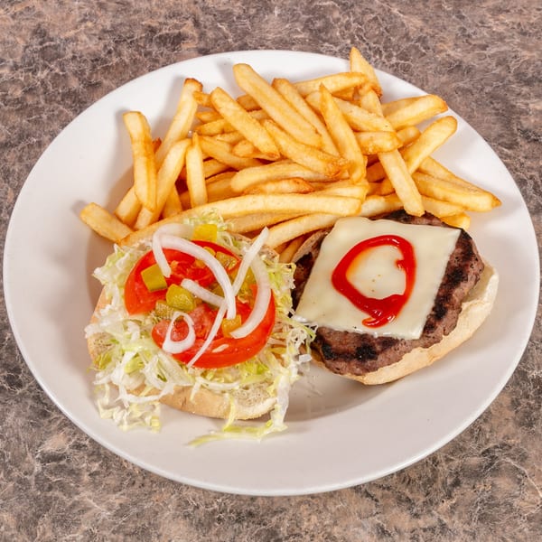 Open-faced cheeseburger with lettuce, tomato, onions, pickles, and a side of golden fries.
